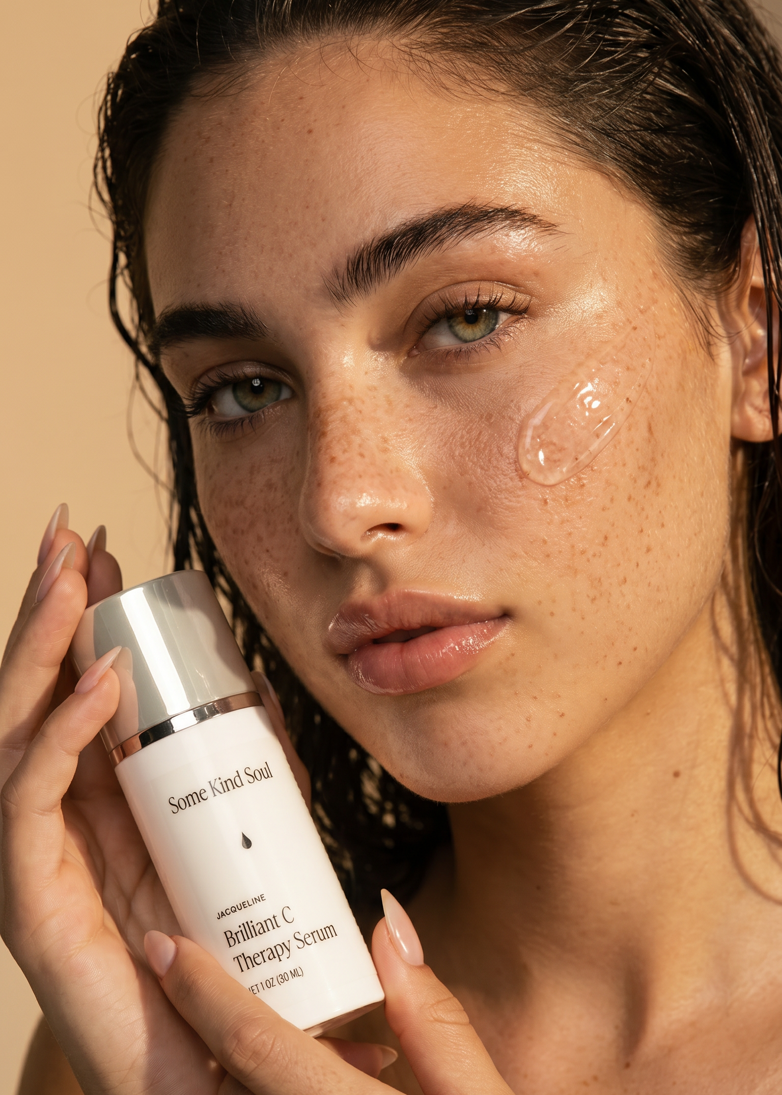 Woman holding a skincare product with a neutral background