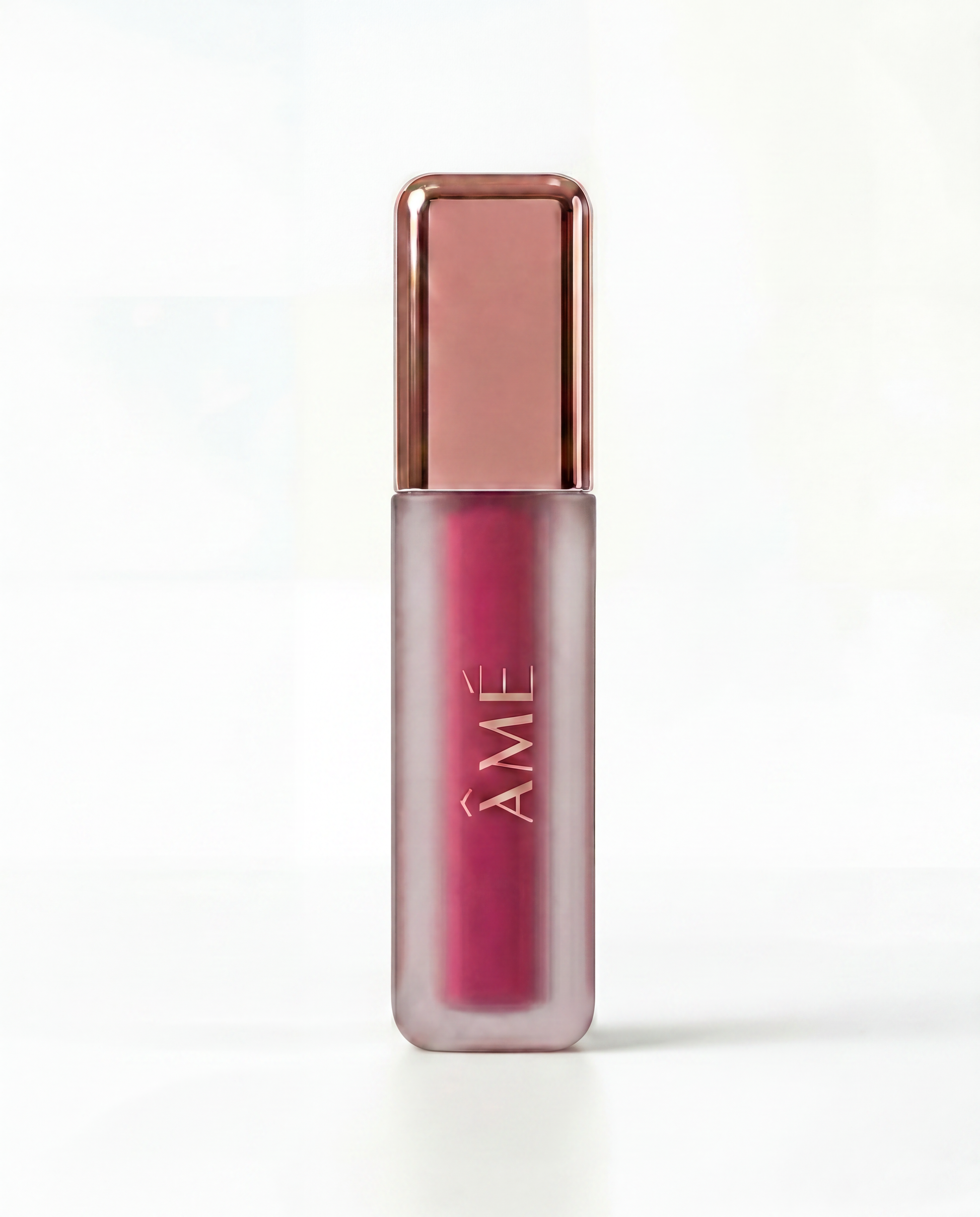 blush tint with rose gold cap on a white background