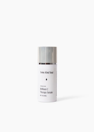 Skincare bottle with silver cap on a white background