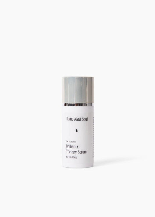 Skincare bottle with silver cap on a white background